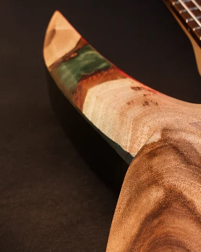 A Llamas guitar body: green-accented edge