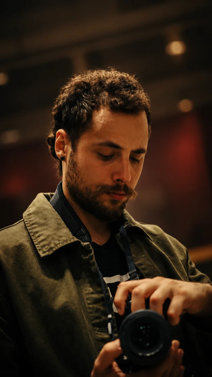 Ignacio, founder of Llamas Custom Guitars, holding a camera